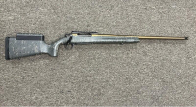 Christensen Arms Mesa Long Range Bolt action, 26 in 1-10 twist Barrel, 300 Winchester Magnum, Bronze finish, after market cheek riser, 0 MOA scope rail, OEM compensator, OEM carbon fiber composite camo stock, OEM trigger