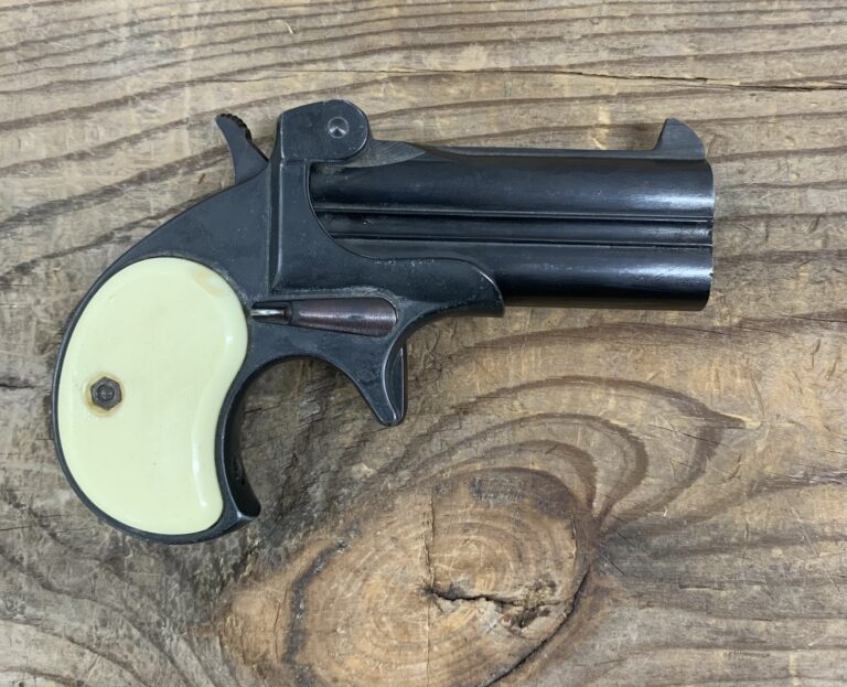 DERRINGER EXCAM MODEL TA 38 DOUBLE BARREL .38 SPECIAL #6216, SINGLE ACTION TWO SHOT OVER UNDER BARREL PISTOL, LEFT SIDE OF BARREL MARKED “DERRINGER EXCAM HIALEAH FLA – MOD. TA 38 CAL. .38 SP” 3″ BARREL DERRINGER EXCAM MODEL TA 38 DOUBLE BARREL .38 SPECIAL #6216, SINGLE ACTION TWO SHOT OVER UNDER BARREL PISTOL, LEFT SIDE OF BARREL MARKED “DERRINGER EXCAM HIALEAH FLA – MOD. TA 38 CAL. .38 SP” 3″ BARREL